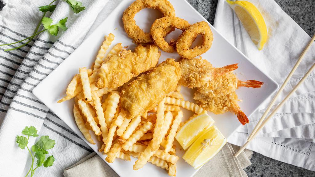 Fish Combo & Chips · Beer-battered and Fried Cod Fish, Fried Mushroom and Shrimp, French Fries, Tartar Sauce