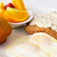 Chicken Fried Steak & Eggs · Your choice of eggs (two total). Served with a breaded & fried beef patty smothered with cou...