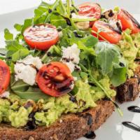 Feta-Avocado Toast · Healthy, Vegetarian. Artisan grain bread with avocado, arugula, cherry tomatoes, feta, and b...