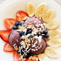 Vegan Acai Bowl · Healthy, Vegetarian, Vegan. Acai berry sorbet with strawberries, blueberries, bananas, slice...