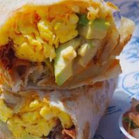 Cali Breakfast Burrito · Scrambled eggs, bacon, cheddar, home fries, and avocado in a flour tortilla. Served with hom...