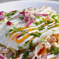 Chilaquiles Bowl · Corn tortilla chips topped with your choice of sauce. Topped with your choices of eggs & mea...