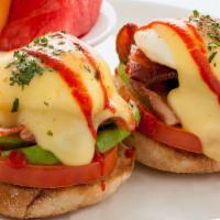 Golden State Benedict · Toasted english muffin topped with grilled tomato, avocado, applewood-smoked bacon, poached ...