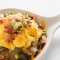 Hash Skillet · Home fried potatoes sautéed with corned beef hash, onions, and bell peppers. Topped with scr...