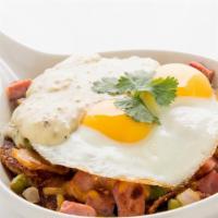 Country Skillet · Home fried potatoes sautéed with ham, bell peppers, and onions. Topped with cheddar cheese, ...