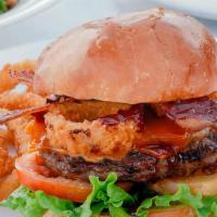 Wild West Burger · Half-pound Angus beef patty, bacon, cheddar, onions rings, BBQ sauce, cheddar, lettuce, toma...