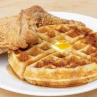 Cluck -N- Crater · Two pieces of succulent, crispy fried chicken with a light and fluffy Belgian waffle.