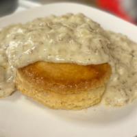 Bicky & Gravy · Southern buttermilk biscuit smothered with a savory homestyle sausage gravy.