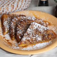 The Nutty  French Toast · 4 1/2 pieces of Texas toast dipped in Divine batter, crusted with frosted flakes and topped ...