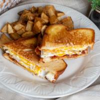 The Bacon Sandwich · Grilled white bread with gooey melted American cheese, 2 over hard eggs and crispy bacon ser...