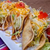 Chicken Tacos · Corn or flour tortillas, your choice of crispy or soft tacos, and filled with lettuce, chees...