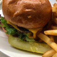 Double Bison Cheeseburger & Fries · A River and Woods Classic. Rock River Ranch bison, natural American cheese, magic sauce, bri...