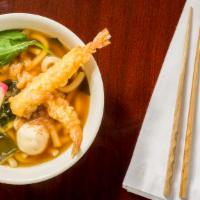 Sodo Seafood Udon · Hot udon noodle soup with shrimp tempura, sound, crab meat, fried tofu, green onion, red pep...