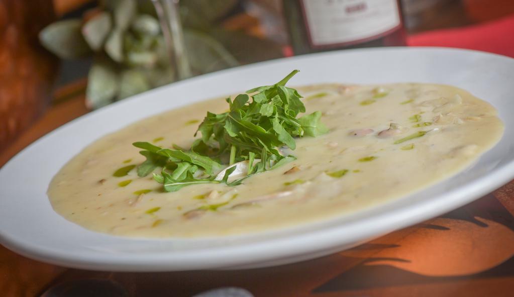 New England Clam Chowder · In-Shell Clams, Potatoes, Bacon, Celery, Onions, Sherry, Cream.