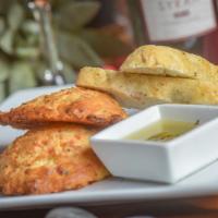 House Made Bread · Chef's selection of Homemade Foccacia Bread, Pretzel Bread, or Cheddar Scallion Biscuit