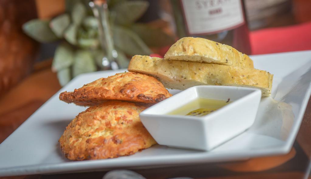 House Made Bread · Chef's selection of Homemade Foccacia Bread, Pretzel Bread, or Cheddar Scallion Biscuit