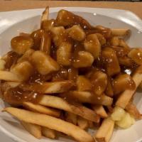 Poutine · French fries with fresh cheese curds and topped with our jack daniels beef gravy. straight f...