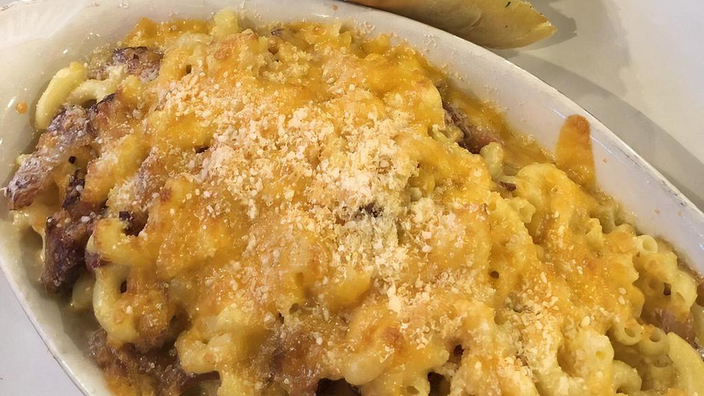 Bacon Mac N' Cheese · Creamy homemade mac and cheese with our famous thick
cut bacon. Topped with more cheese and baked to intensify
the flavor.