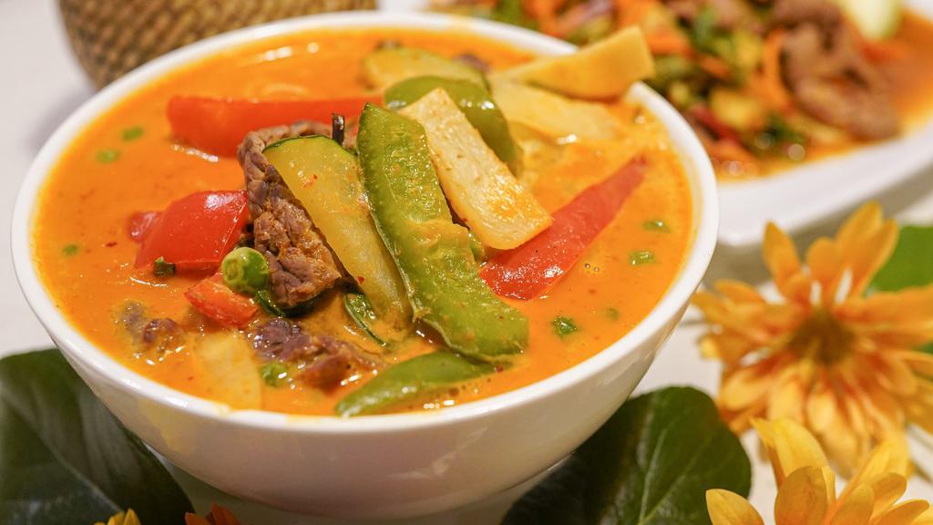 Red Curry · Gluten Free.
Vegan on Request.Bell pepper, zucchini, bamboo and peas. Includes a side of white rice.