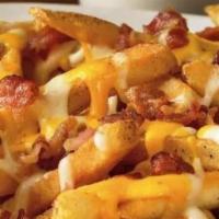 Bacon Cheddar Fries · Regular size order of our Seasoned fries topped with fresh cooked crumbled bacon and your ch...