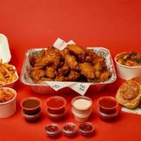 50 Piece Wing Party Pack · 50 piece OG wings + 3 biscuits with spiced honey + 2 cabbage kimchi + 2 sides of your choice...