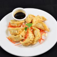 Sweet Basil Pot Sticker · Homemade dumpling stuffed with vegetables and minced pork. Served with Thai style soy ginger...