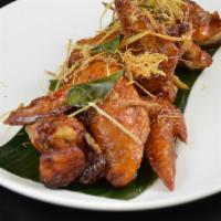 Peek Kai * · Signature wing chicken wings marinated in fish sauce, deep fried, tossed in caramelized garl...