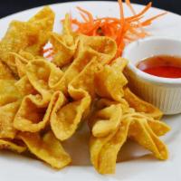 Fried Wonton · Golden fried seasoned ground pork wrapped with wonton skin and served with plum sauce and cr...