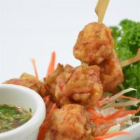 Spicy Lobster Ball · Golden-fried lobster balls topped with our home-style spicy chili garlic lime sauce.