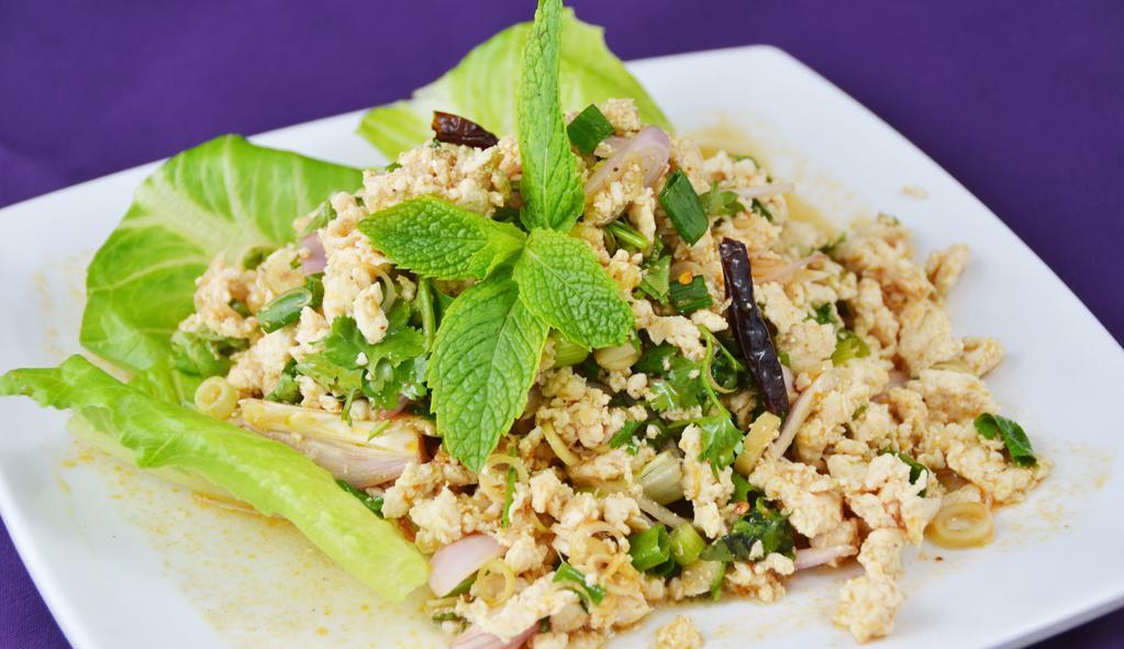 Larb · Ground chicken or tofu mixed with shallot, green onions, lemongrass, cilantro, and mint tossed with spicy lime sauce and served with fresh lettuce.