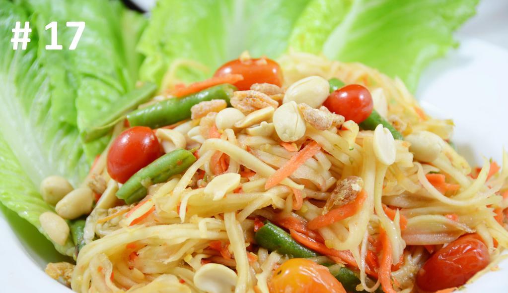 Papaya Salad · Most famous Thai spicy green papaya salad with dry shrimp, green bean, tomato, fresh chili, and garlic in home-style fresh squeezed lime sauce, tamarind serve with fresh cabbage and green bean.