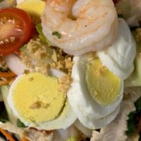 Yum Yai:* · Chicken and shrimp, fresh lettuce, onions, cucumber, and tomatoes, tossed with house vinaigr...