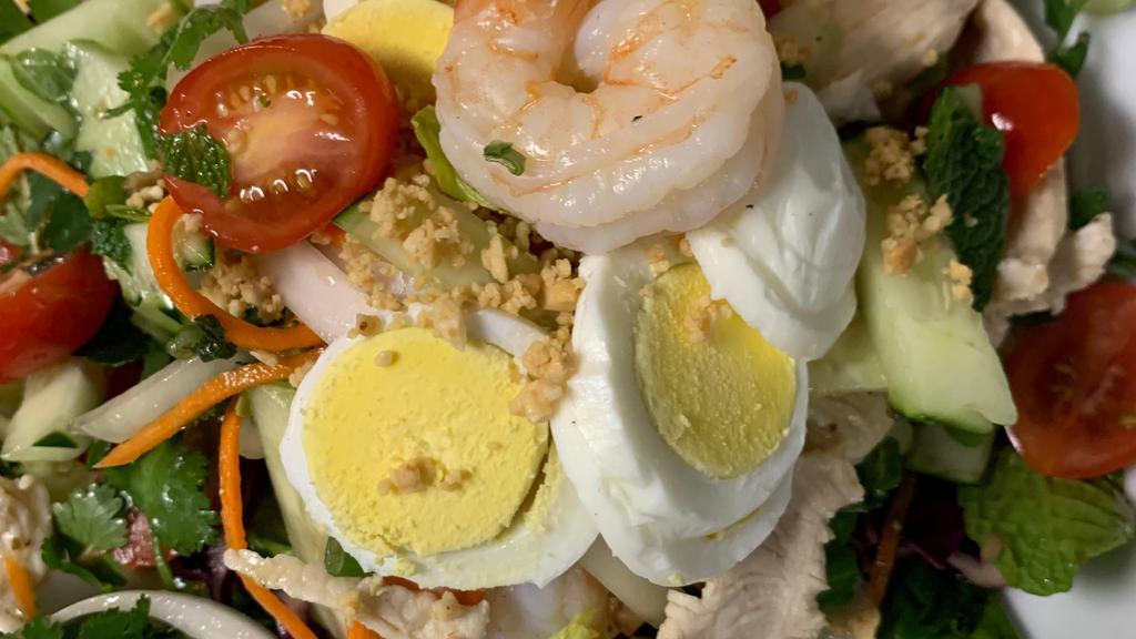 Yum Yai:* · Chicken and shrimp, fresh lettuce, onions, cucumber, and tomatoes, tossed with house vinaigrette dressing 
      and topped with hardboiled egg and crushed peanuts.