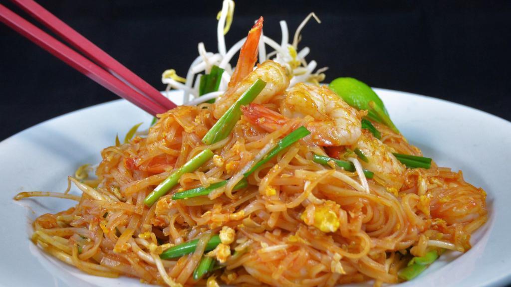 Pad Thai · Most famous of Thai noodles stir fried with choice of protein, egg, green onions, bean sprouts, and cracked peanuts.