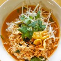 Tom Yum Noodle Soup · Rice noodles in spicy Tom Yum soup with minced chicken or choice of protein bean sprouts, an...