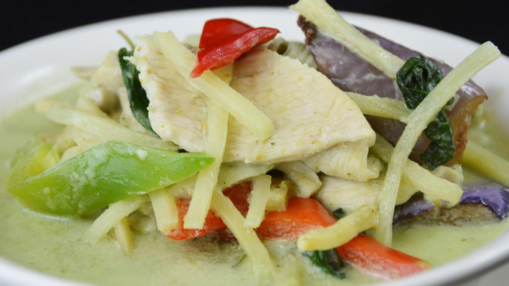 Green Curry · Choice of meat, oriental eggplants, bamboo shoots, bell peppers, coconut milk, and basil leaves in a Thai green curry.