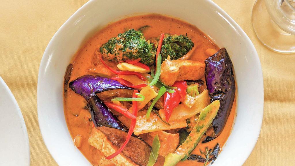 Red Curry · Choice of meat, oriental eggplants, bamboo shoots, bell peppers, and basil leaves in Thai red curry paste.
