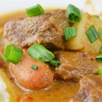 Beef Mussamun · Slow cooked beef, Carrots, potatoes, onions, and peanuts in a rich Thai mussamun curry. (Ser...