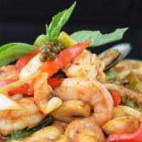 Phad Phet Talay · Stir-fried combination of seafood with homemade curry paste and Thai peppercorn, onions, bel...