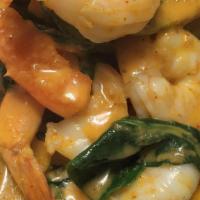 Asian Pumpkin Curry · Delicious red curry with black tiger shrimps, spinach, Thai pumpkin, bell pepper, and sweet ...