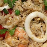 Fisherman Fried Rice · Jasmine rice, crab meat, shrimps, calamari, green peas, carrot, and tomatoes. Stir-fried wit...
