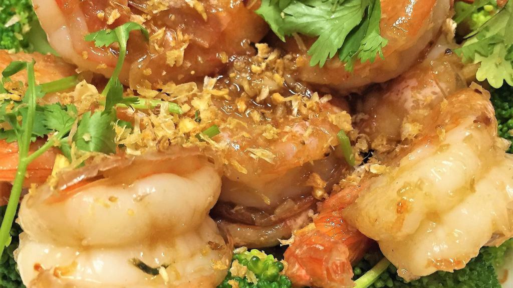 Garlic Prawns · Large tiger prawns sautéed with homemade fresh garlic sauce and black pepper on a bed of broccoli, spinach, and topped with cilantro. Served with jasmine rice.