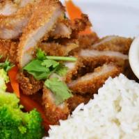 Khao Moo Tod · Golden fried marinated pork loin, steamed broccoli, and carrot over jasmine rice served with...