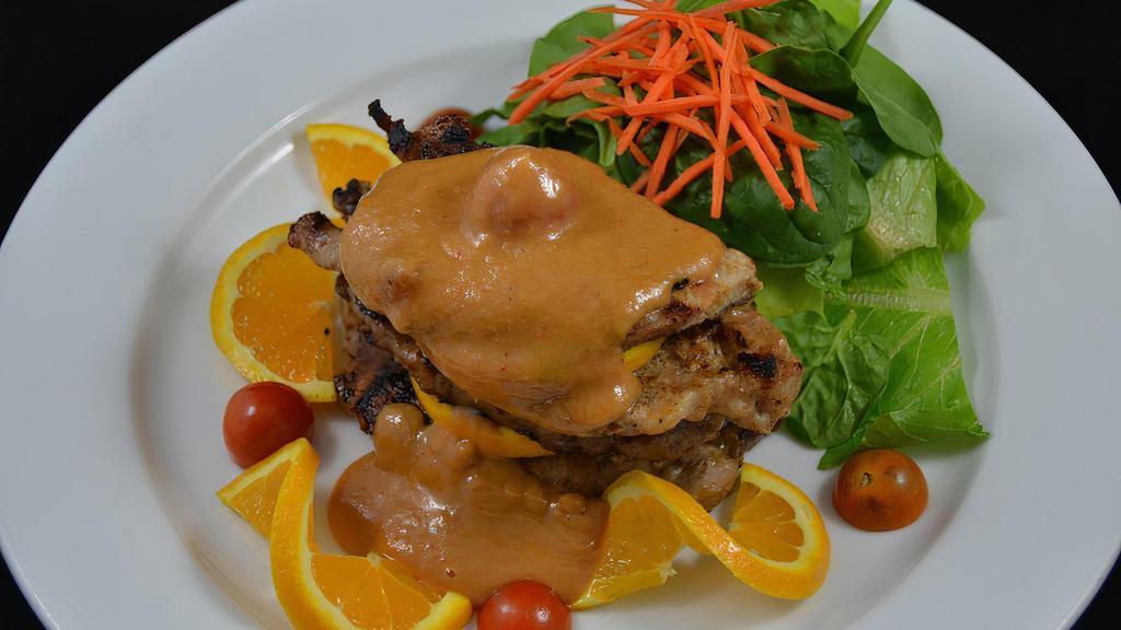 Moo Yang With Peanut Sauce · Marinated pork loin grilled to perfection, topped with peanut sauce. Served with jasmine rice.