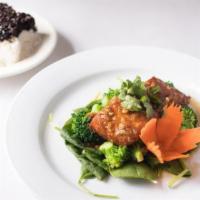 Garlic Salmon · Pacific salmon sautéed with black pepper, homemade fresh garlic sauce on a bed of broccoli, ...