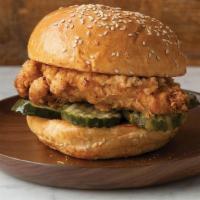 Fried Chicken Sandwich · Fried chicken and dill pickle chips on a sesame bun.