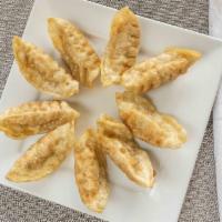 Pot Stickers (9) · Most popular. Pan-seared dumplings filled with chicken, cabbage and onion.