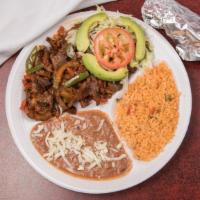 Steak Ranchero · Steak onion tomatoes Chile’s rice and beans