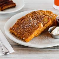 Cornflake Crusted French Toast · Thick sourdough bread dipped in a seasoned egg batter and breaded with crushed corn flakes. ...