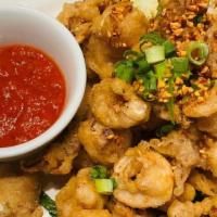 Salt And Pepper Calamari · Fried calamari tossed with salt and pepper, fried garlic chips and green jalapenos and serve...